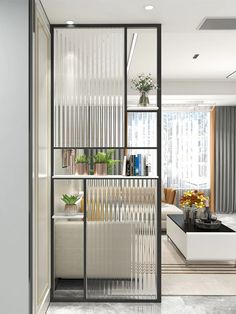 a living room filled with furniture next to a window covered in sheer curtained curtains