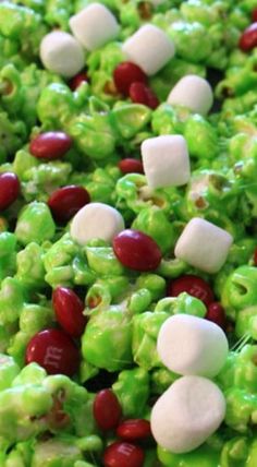 green and red candies with marshmallows on them are ready to be eaten