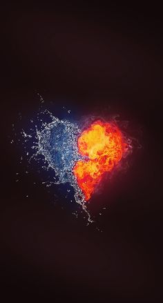 an orange and blue heart shaped object with water splashing on it's side