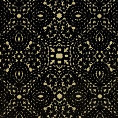 an intricate black and white pattern on fabric