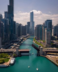 a river running through a large city next to tall buildings