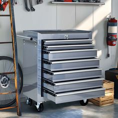 a metal tool box sitting next to a bicycle