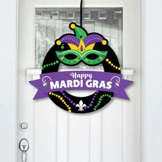 a mardi gras door hanger on a front door