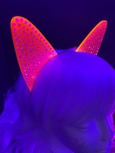 --==TIME TO GET YOUR BLING ON==--Elevate your rave or EDC outfit with these stunning Pavé Rhinestone Fluorescent Neon Cat Ears! Not only do they add a touch of cyberpunk flair, but they also glow in blacklight, making you stand out in any party or festival. Be the center of attention and let your inner feline shine! These Pavé Rhinestone Fluorescent Neon Cat Ears are made from 3mm cast acrylic which is laser engraved (each rhinestone circle) and laser cut. They are attached to a metal headband a Black And Neon Rave Outfits, Neon Rave Aesthetic, Black Cat Ears Costume Accessories For Rave, Uv Reactive Lingerie, Glow In The Dark Cat Collar, Neon Rave, Neon Cat, Edc Outfits, Welcome To The Future