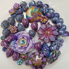 a white plate topped with lots of purple flowers