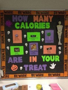 a bulletin board that says how many calories are in your treat and halloween decorations