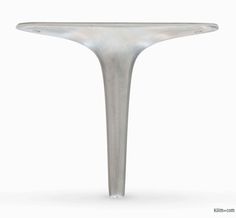 a white table with a metal base on the top and one leg in the shape of a cone