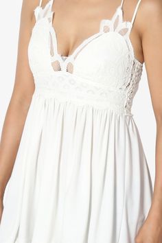 Step into the spotlight in this crochet camisole with a draped jersey and a scalloped front bodice. Draped, pleated on a waist top for the most flirty and alluring top that will turn heads on date night. Wear it with denim shorts and sandals for summer look.Plunge V-neck, Adjustable crossback spaghetti strapsSmocked back, Feminine sleeveleess, Padded bust, Medium support bustPleated hem, Scalloped front bodice, Tunic length, Fully lined front bodiceFits small to US size, S=Size(0-4), M=Size(4-8) Crochet Camisole, Free People Adella, On Date, Bohemian Summer, Lace Peplum, L And Light, Night Wear, Beach Travel, Tunic Length