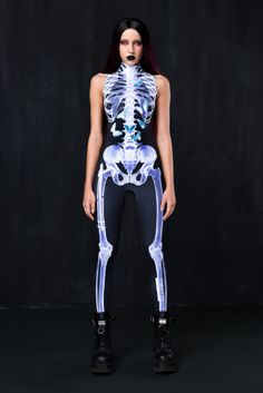 a woman in skeleton bodysuit posing for the camera with her hands on her hips