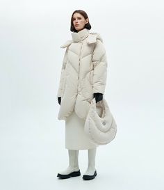 A-silhouette puffer made of medium-length natural goose down “Wave”. A down jacket with asymmetric stitches and hidden fasteners, which makes it even warmer in the cold season. Voluminous hood with cuff, secret pocket on the lining. The puffer is made of water-repellent and windproof fabric with an additional ARCTIC membrane. Accent, bright, light and reliable under any conditions. Winter White Down Puffer Jacket With Detachable Hood, White Duck Down Outerwear With Detachable Hood, White Duck Down Puffer Outerwear, White Quilted Puffer Jacket For Cold Weather, Quilted Winter White Puffer Jacket For Cold Weather, Winter White Quilted Puffer Jacket For Cold Weather, White Duck Down Puffer Jacket With Padded Collar, Secret Pocket, Cold Season