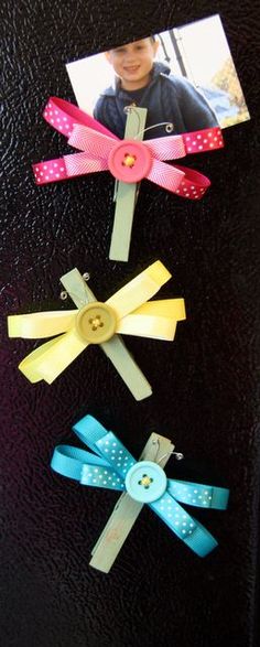 four different types of hair clips on a black surface with a child's face in the background