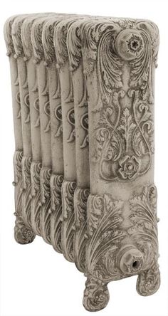 an old fashioned radiator with ornate carvings on it's sides and the top section