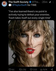 taylor swift on twitter with red lipstick and long curly hair in front of her face