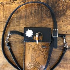 Hand Tooled Genuine Leather Cellphone Carry Case. Can Be Worn As Crossbody Purse Or Clipped To Belt Loops On Pants. Fits Most Cellphones. Leather Wallet With Mobile Phone Bag For Personal Use, Leather Wallet With Mobile Phone Bag, Leather Pouch Phone Bag For Personal Use, Tooled Leather, Custom Bags, Custom Leather, Leather Tooling, Crossbody Purse, Black Tan