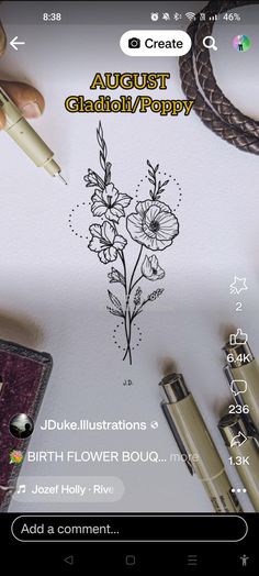 someone is drawing flowers on the paper with their pen and some other items around them