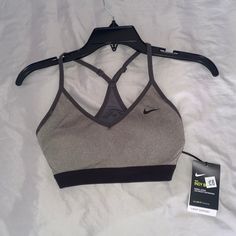 Gray And Black Nike Sports Bra Brand New! Women’s Size Medium Gray Stretch Sports Bra For Sports Season, Gray Go-dry Sports Bra For Running, Gray Activewear With Light Support, Sporty Gray Sports Bra For Running, Gray Activewear For Training, Gray Activewear For Training And Sports Season, Heather Grey Athleisure Activewear For Sports, Gray Sports Bra For Gym, Gray Sports Bra For Training