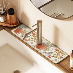 a bathroom with a sink, mirror and soap dispenser on the counter