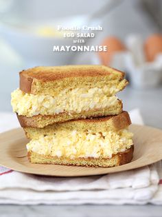 two pieces of bread stacked on top of each other with the words mayonnaise in front of them