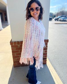 Wrap yourself in the cozy comfort of our Jane Fringe Poncho. It’s a stunning cable knit cape, accented with a vibrant multi-color fringe detail that unarguably stands out. This pullover is not just a stylish accessory, it's an experience of unmatched warmth and comfort. The poncho features a loose fit design to keep you at ease throughout the day, making it an excellent choice for those chilly days and cool nights. The multi-color fringe detailing adds a playful pop of color to the subdued cable Casual Spring Poncho With Tassels, Trendy One-size Poncho For Spring, Spring Poncho One Size With Tassels, Spring Poncho With Tassels One Size, One Size Spring Poncho With Tassels, Spring Poncho With Tassels, One Size Tassel Poncho For Spring, Pink One-size Poncho For Fall, Pink One Size Poncho For Fall