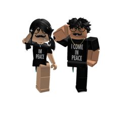 two people with black shirts and one is holding a sign that says i'm in peace