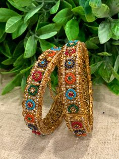 Antique bangle with multi color stone setting. Pearl and navratan style Monalisa polki work . Very unique design. About one inch wide. Comes in a pair. Designer item. Multi Stone, Stone Settings, Stone Color, Multi Color, Bangles, Unique Designs, Brass, Stone, Gold