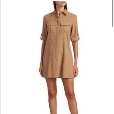 Utilitarian Shirtdress Finished With Classic Roiled Cuff. Spread Collar Short Sleeves Rolled Cuff Concealed Button Placket Linen/Elastane Dry Clean Imported Formal Shirt Dress With Button Cuffs And Spread Collar, Formal Shirt Dress With Spread Collar And Button Cuffs, Casual Shirt Dress With Cuffed Sleeves For Work, Elegant Button-up Shirt Dress With Rolled Sleeves, Collared Shirt Dress With Cuffed Sleeves For Work, Elegant Fall Shirt Dress With Cuffed Sleeves, Formal Spread Collar Shirt Dress With Pockets, Chic Office Shirt Dress With Roll-up Sleeves, Chic Shirt Dress With Roll-up Sleeves For Office