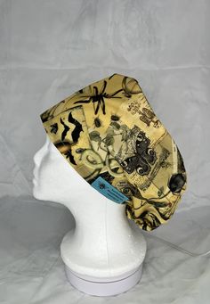 Pixie style scrub hat with a draw string of elastic and a plastic toggle to help you get that perfect fit. Extremely comfortable and made with cute cotton fabric. They are a great way to show your personality while at work.  Pattern placement will vary per each hat. With a minimalist look but surprisingly generous fit, this cap will hold long or short hair in place, including a high ponytail or bun. The adjustable toggle will give you the snug fit you need.  Slightly smaller than my standard Eur Work Pattern, Surgical Scrub Hats, Pixie Styles, High Ponytail, Womens Scrubs, Sewing Studio, Scrub Hat, Head Shapes, Scrub Cap