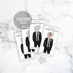 three business cards with an image of a man in a suit and tie on them