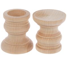 two wooden candlesticks sitting next to each other