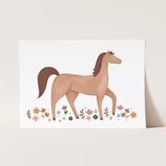 a card with an image of a horse on it's back and flowers in the background