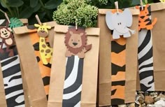 some brown paper bags with animals and zebras on them