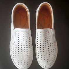 Comforting Slip On Shoes With Pillow Top Memory Foam White Slip-ons With Perforated Toe Box, White Leather Slip-ons With Ortholite Insole, White Slip-ons With Ortholite Insole, White Perforated Round Toe Slip-ons, White Closed Toe Slip-ons For Spring, Casual White Slip-ons With Perforated Toe Box, Summer Slip-ons With Perforations Low-top, Summer Low-top Slip-ons With Perforations, White Slip-ons With Perforations