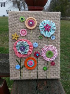 a canvas with buttons and flowers on it