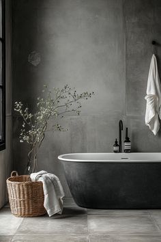 a bath tub sitting next to a window with a plant in the middle of it