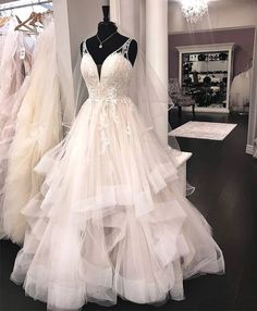 a wedding dress on display in a store