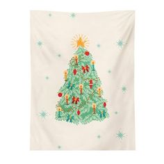 a christmas tree tapestry hanging on a wall