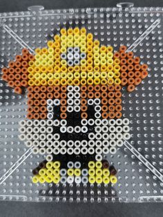 an image of a pixel art made out of legos and plastic beads on a table