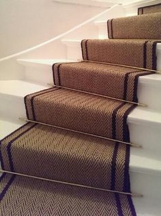 a set of stairs with carpeted treads and handrails on each side