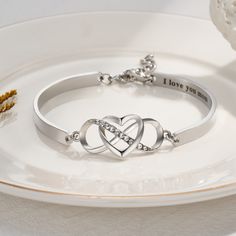 Infinity and Heart Design - This stunning bracelet features an infinity and heart charm that can be engraved with a name or message of your choice, making it a truly unique and special piece of jewelry. Ideal Gift - It's a perfect gift for your daughter, mom, wife, or any special person in your life. You can customize the content on the card to express your good wishes. Keep Me in Your Heart Bracelet - The infinity and heart design of this bracelet symbolizes eternal love and affection, mak... Bracelet With Name, Keep Me In Your Heart, Mom Necklace Personalized, Heart Bangle Bracelet, Silver Heart Bracelet, Daughter Mother, Infinity Heart, Photo Necklace, Mom Necklace