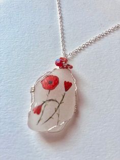 Delicate red poppies English wildflower necklace - 18 inch silver plated chain, miyuki beads and wire wrapping.Crafted and painted to order :-) Happy to take requests please feel welcome to message me. Handmade Red Flower Necklace Adjustable, Whimsical Red Hand Painted Jewelry, Handmade Red Flower Necklace With Adjustable Fit, Handmade Adjustable Red Flower Necklace, Silver Wire-wrapped Necklace With Czech Glass, Silver Wire Wrapped Necklace With Czech Glass, Hand Wrapped Red Necklace As Gift, Red Hand Wrapped Necklace As Gift, Red Hand Wrapped Necklace For Gift