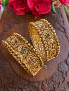 Elevate your traditional attire with our exquisite collection of Matt finish gold-plated Rajwada bangles. Each piece is a testament to craftsmanship, blending cultural richness with contemporary elegance. Our Indian jewelry ethnic kadas showcase timeless beauty, capturing the essence of tradition in every detail. Explore the allure of our temple jewelry-inspired bracelets, where heritage meets modernity. Embrace the legacy of fine craftsmanship with our traditional bangles, a celebration of Indian artistry that transcends time. Based on silver and copper alloy Highest quality and craftsmanship  You can pair these bangles with traditional banarsi sarees or lehengas. This will look great with zari silk sarees. We recommend you to wear this with pink or gold coloured saree. These bangles will Luxury Traditional Meenakari Bangle, Festive Zari Work Bracelets For Diwali, Festive Diwali Bracelets With Zari Work, Festive Ceremonial Bangle Bracelets, Traditional Openable Bracelets For Diwali, Bollywood Style Cutdana Bracelets For Rituals, Elegant Festive Bangle With Zari Work, Elegant Gold Bangle With Zari Work, Festive Ceremonial Bangle Bracelet