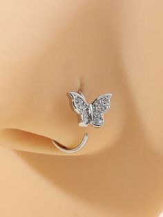 a close up view of a ring with a butterfly on the front and back of it