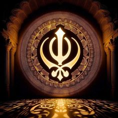 an image of the symbol of sikh on display in a dark room with light shining through it