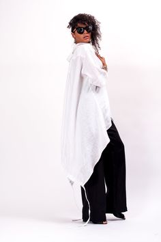 Easy and breezy, the Unstoppable Oversized linen shirt women features an asymmetrical construction, with a cut to adjust the length of the back, relaxed sleeves and front button closure. With pants, this White linen half sleeve shirt makes Monday mornings bearable. The White asymmetrical shirt is designed to be comfortable and not troublesome to wear. After wearing this Oversized linen shirt women, you will love it even more. The White half sleeve womens linen top is made of high quality linen f Linen Shirt Women, Wholesale Clothing Vendors, Oversized Linen Shirt, Half Sleeve Shirt, Asymmetrical Shirt, Linen Top Women, Goth Shirt, Linen Shirts Women, Linen Crop Top