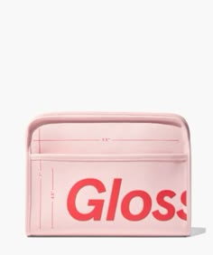 a pink purse with the word gloss printed on it's front and side pockets