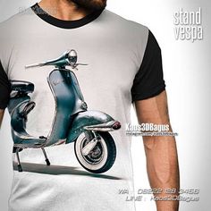 a man wearing a t - shirt with an image of a scooter on it