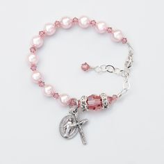 Made with genuine Swarovski crystals and pearls throughout. No seed beads. Please let me know the date of the event along with personalization details, if applicable, in the notes box at checkout. Celebrate the Baptism of a baby girl with this beautiful Swarovski crystal rosary bracelet featuring blush rose crystals and light rosaline pink pearls. This rosary bracelet features genuine Swarovski crystals and crystal pearls throughout. The bracelet may be personalized with one single letter if you Elegant Adjustable Pink Rosary Bracelet, Elegant Pink Adjustable Rosary Bracelet, Elegant Pink Rosary Bracelet For Wedding, Elegant Pink Wedding Rosary Bracelet, Adjustable Pink Rosary Bracelet For First Communion, Personalized Pink Rosary Bracelet For Baptism, Adjustable Pink Jewelry For Baptism, Pink Beaded Jewelry For First Communion, Elegant Pink Bracelets For First Communion