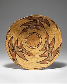 a brown and black bowl sitting on top of a table