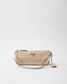 Travertine Prada Re-edition 2002 Small Leather Shoulder Bag | PRADA Neutral Bag, Leather Key Ring, Small Shoulder Bags, Beige Bag