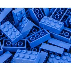 a pile of blue legos sitting next to each other